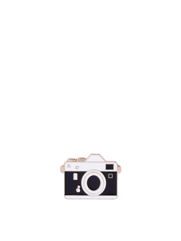 Poppy & Peonies Enamel Pin featuring a vintage black and silver camera with a circular lens and gold-tone accents.