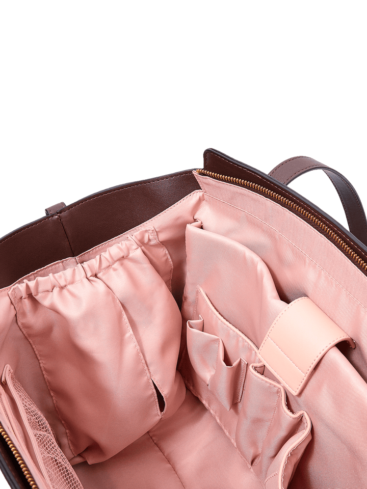 Poppy & Peonies Avenue Tote in Espresso Suede interior close-up, highlighting elasticized pockets and multiple slip pockets for organized storage.