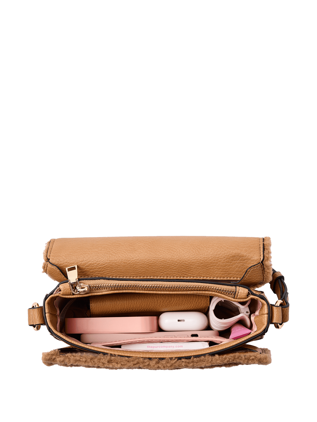 Interior of a brown faux fur crossbody bag with a vegan leather strap