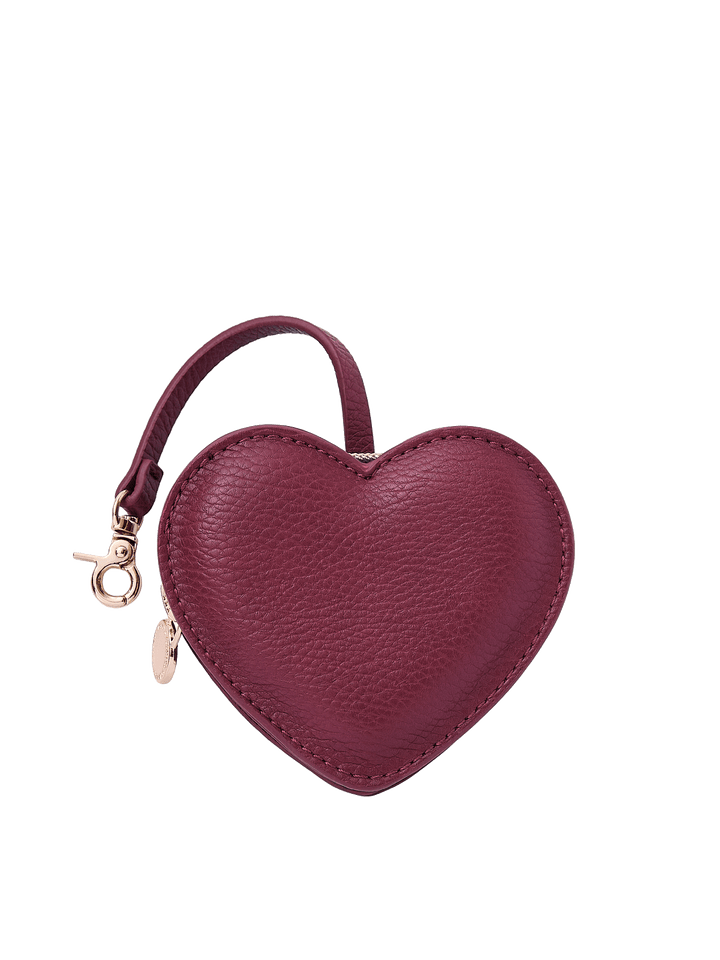 Poppy & Peonies Berry Heart Bag Charm front view, featuring a heart-shaped design in a rich berry tone with a short strap, clasp and gold-tone hardware.