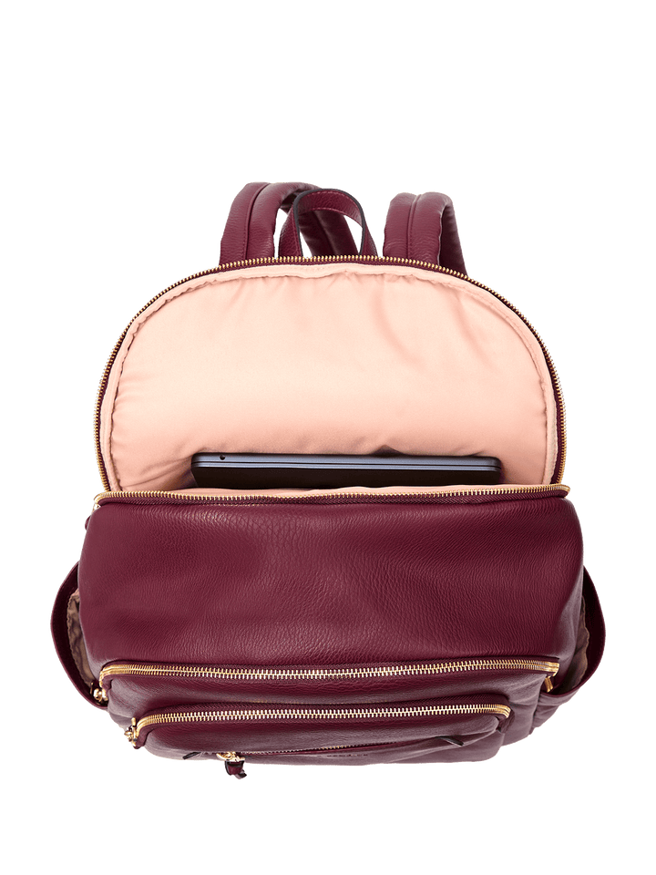 Berry coloured backpack with pink interior and laptop inside on a transparent background