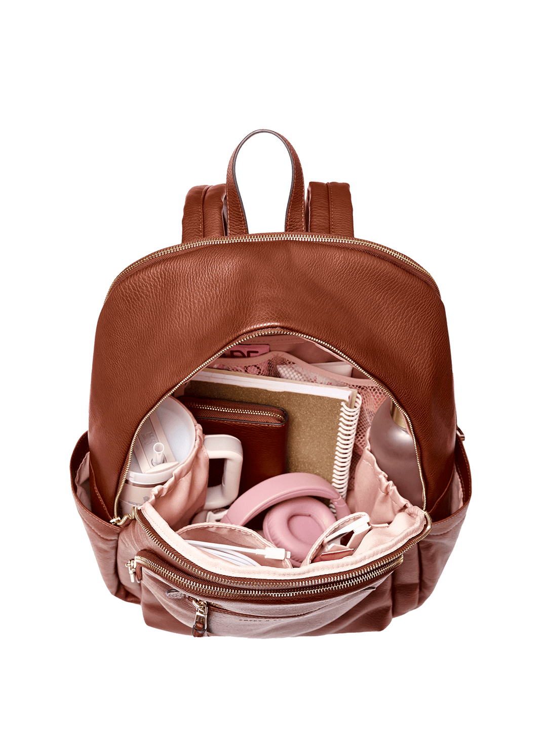 Brown backpack with items including a notebook and a pink object on a transparent background