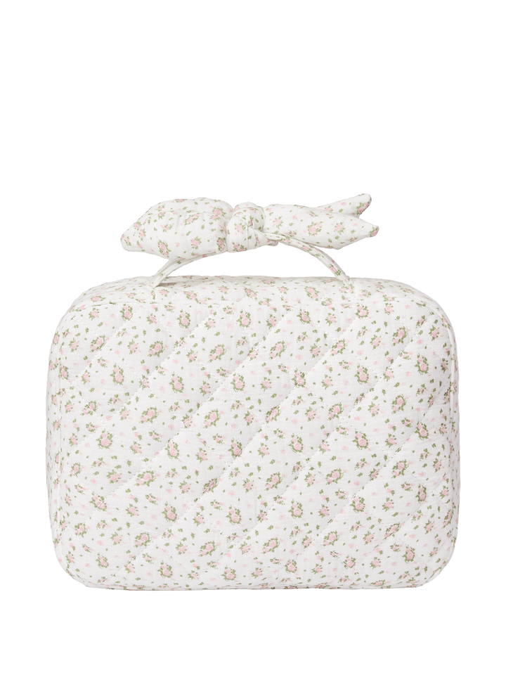 Floral-patterned travel toiletry bag with a bow