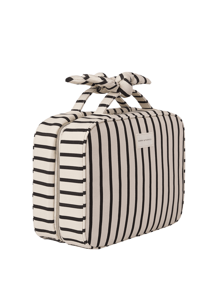 Black and white striped travel cosmetic case with a bow