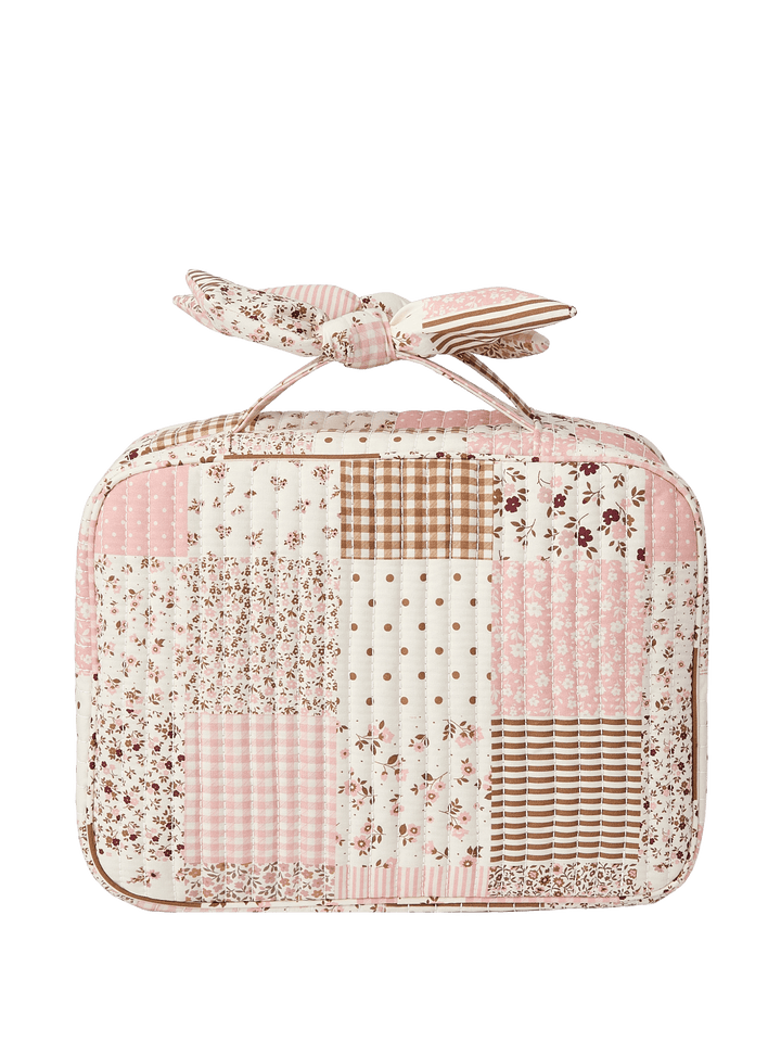 Patchwork-style pink and white cosmetic bag with a bow
