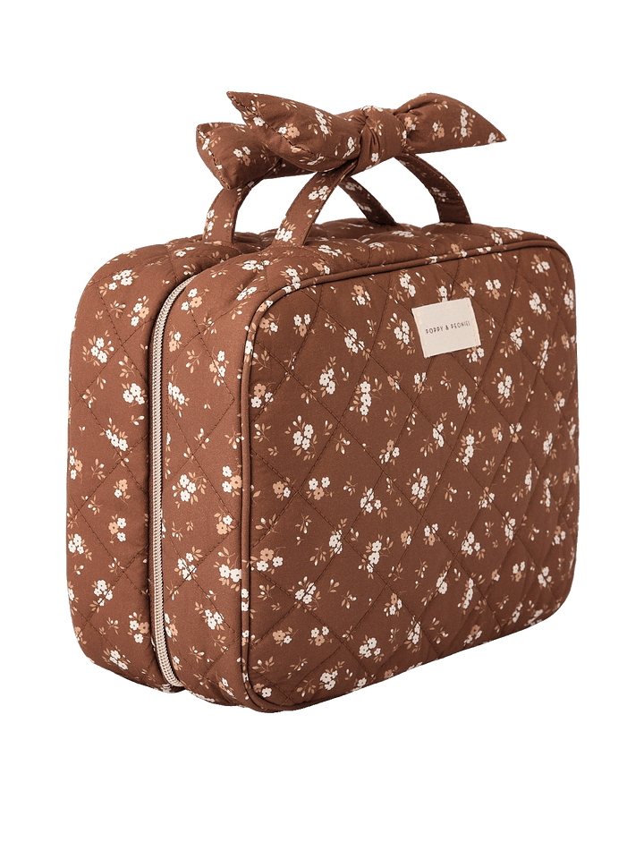 Angled side view of Large Hook Me Up Cosmetic Case in Brown Floral