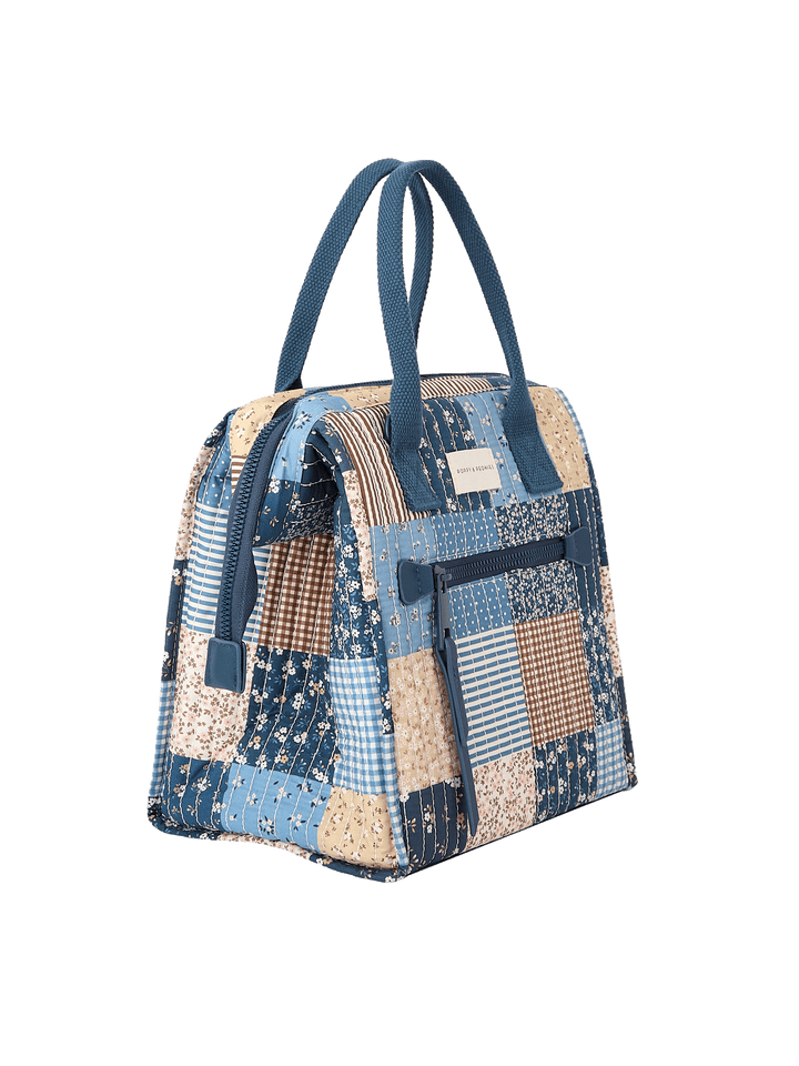 Angled side view of The Lunch Bag in Navy Patchwork