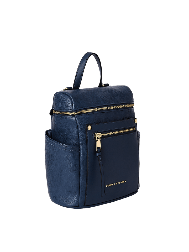 Small navy blue backpack with gold zippers