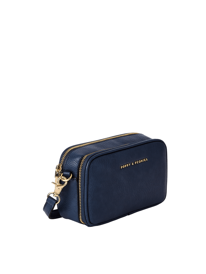 Navy blue handbag with gold zipper and hardware