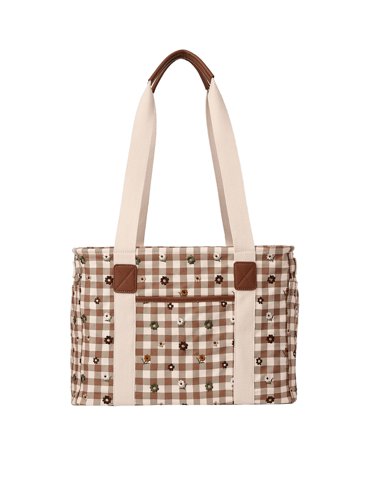 Poppy & Peonies Mini Traveller in October Gingham, featuring a brown and cream checkered canvas exterior with scattered floral embroidery, long cream shoulder straps, and brown trim details.