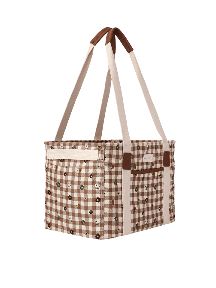 Poppy & Peonies Mini Traveller in October Gingham, showcasing its roomy rectangular silhouette, floral-embroidered gingham pattern, cream shoulder straps, and exterior side pocket.