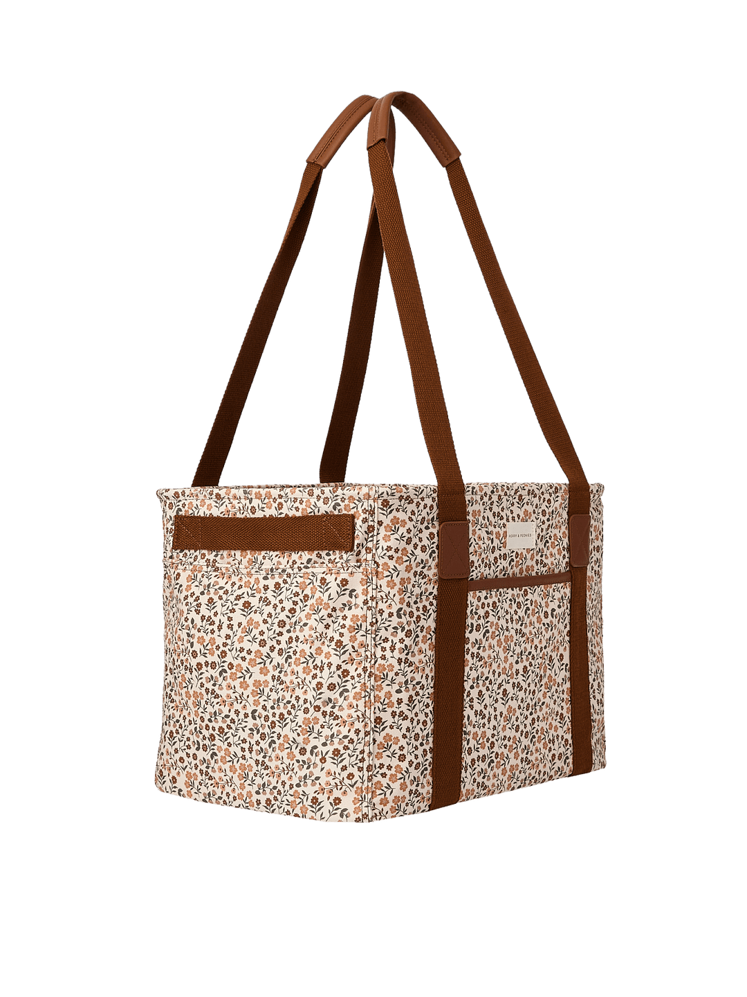 Poppy & Peonies Mini Traveller in October Floral, shown from the side with a roomy rectangular silhouette, long brown shoulder straps, and an exterior side pocket.