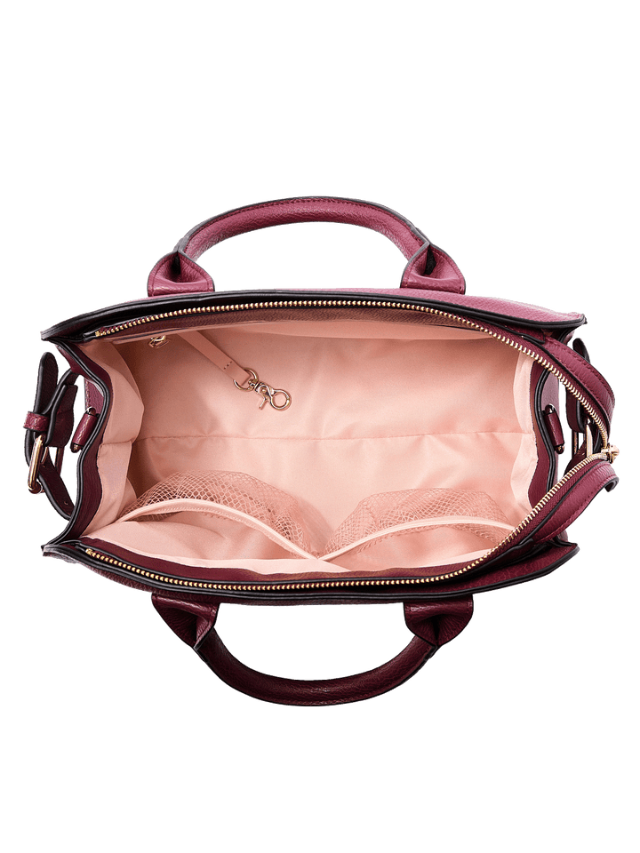 Interior of the Mini Uptown Tote in Berry showing mesh pockets, zip pocket, key leash, and organized compartments
