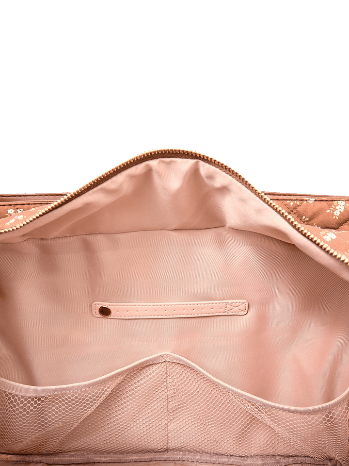 Interior slide pocket and jewelry tab inside Mini Voyager tote in Brown Floral