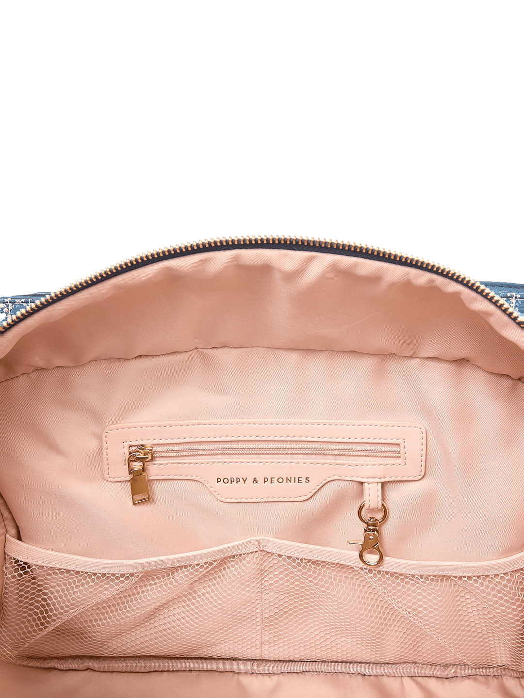 Interior zip pocket and mesh organizer pockets inside Mini Voyager tote in Navy Patchwork