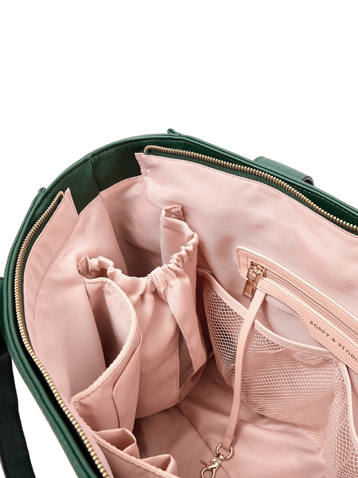 Close-up of Multitasker tote in Heritage Green interior with mesh pockets, key leash, and water bottle holders