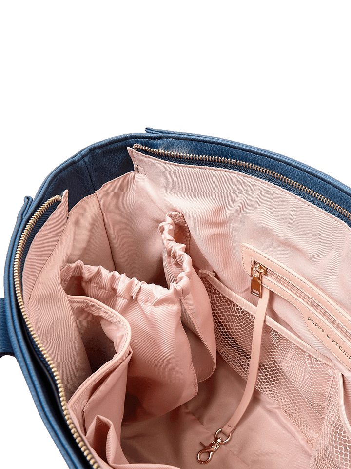 Close-up of Multitasker tote in Navy interior with mesh pockets, key leash, and water bottle holders