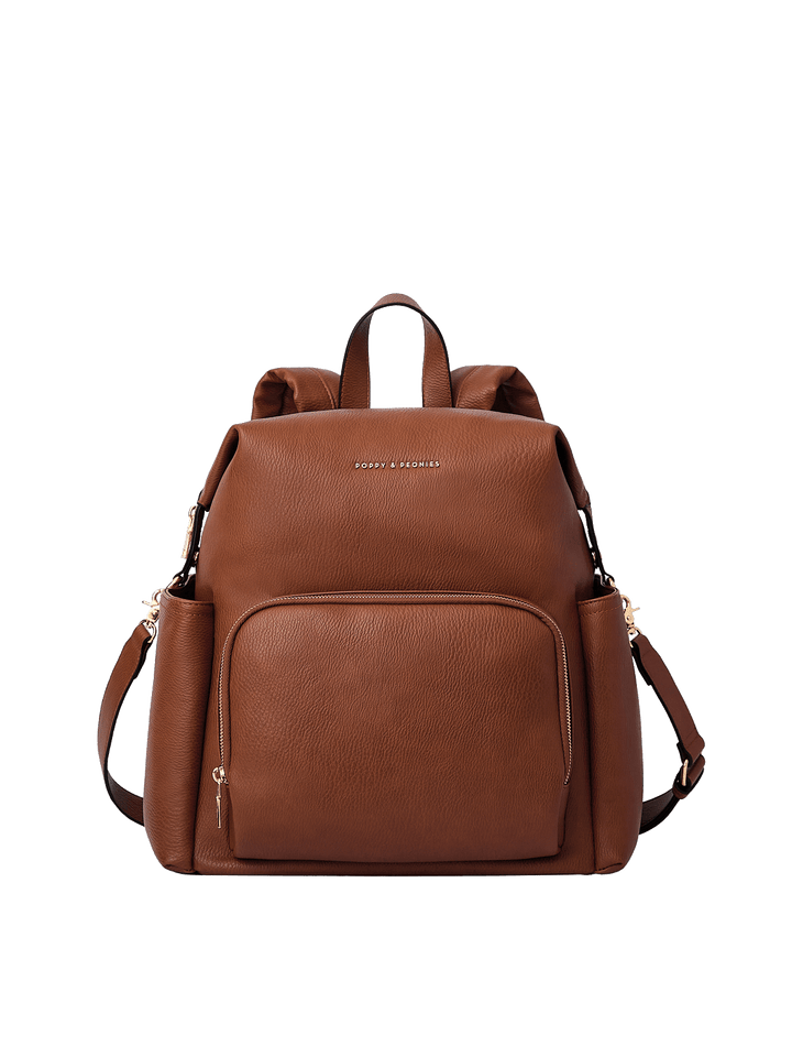 Poppy & Peonies The Cabin Backpack in Chestnut, showcasing its structured silhouette, spacious front zippered pocket, top carry handle, and detachable shoulder strap.