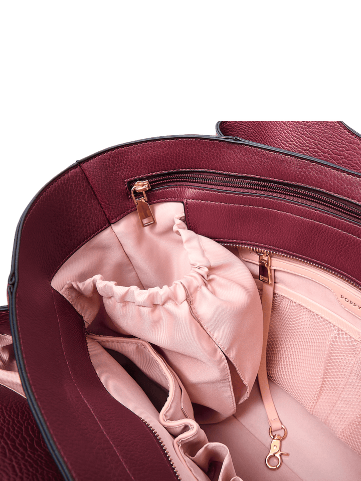 Poppy & Peonies The Companion Tote in Berry interior close-up, featuring organizational pockets and gold-tone hardware.