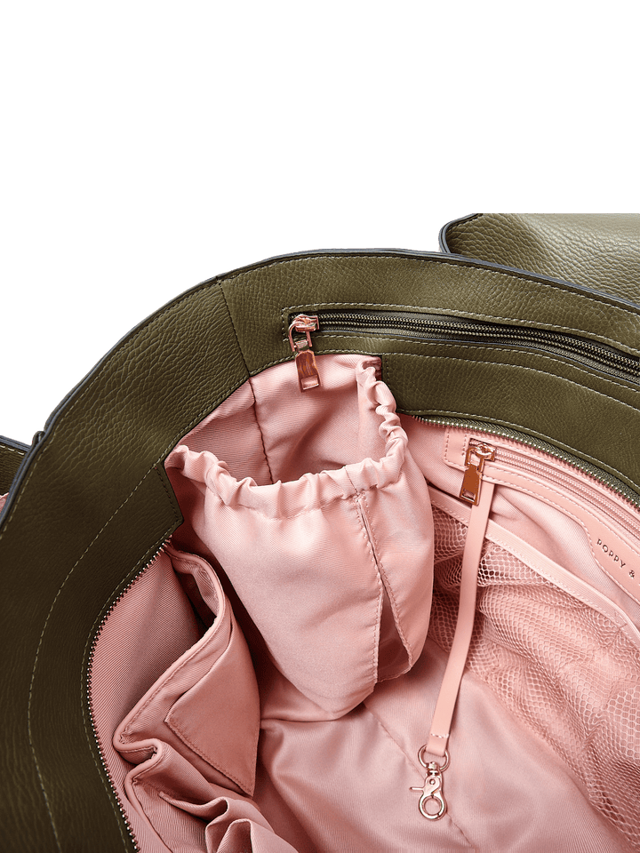 Poppy & Peonies The Companion Tote in Olive interior close-up, showcasing the blush-pink lining, cupholder, zipper pocket and organizational compartments.