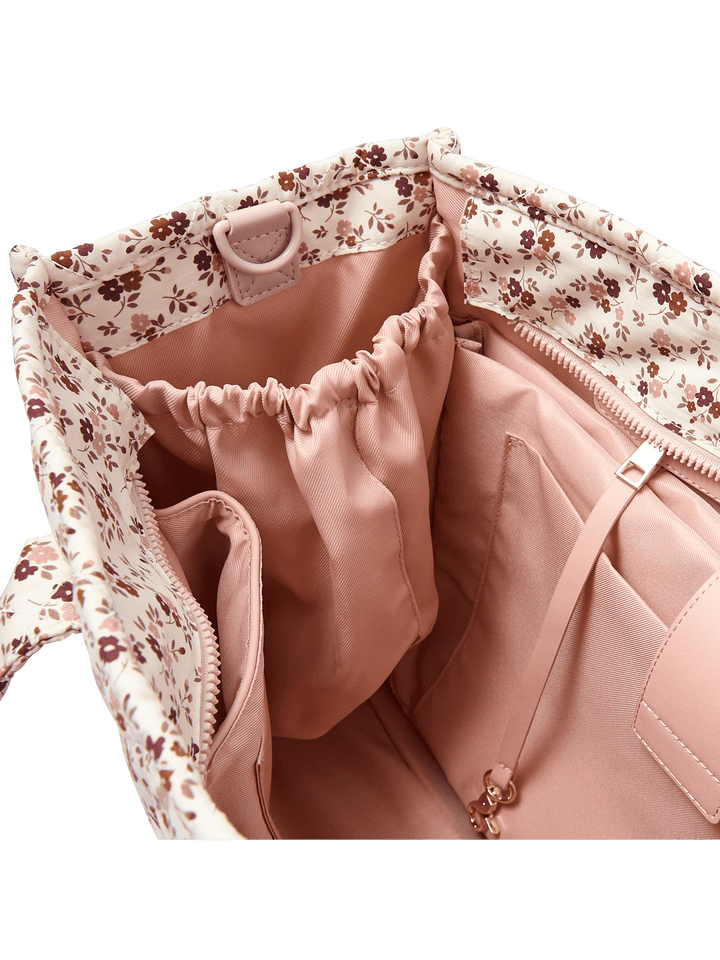 Water bottle pocket on a floral-patterned tote bag