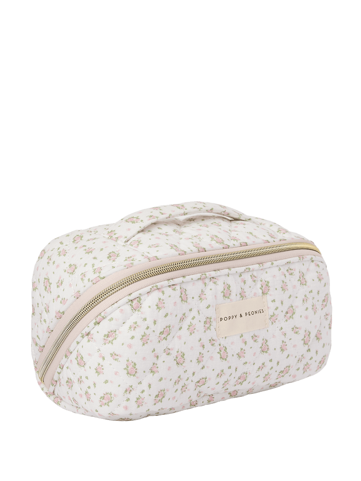 Floral-patterned cosmetic bag with a gold zipper