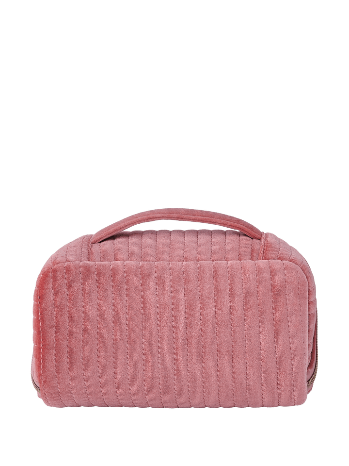 Pink velvet quilted cosmetic bag with a handle