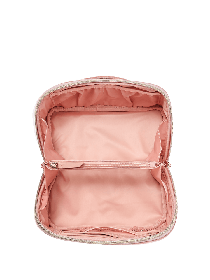 Interior of a pink velvet quilted cosmetic bag