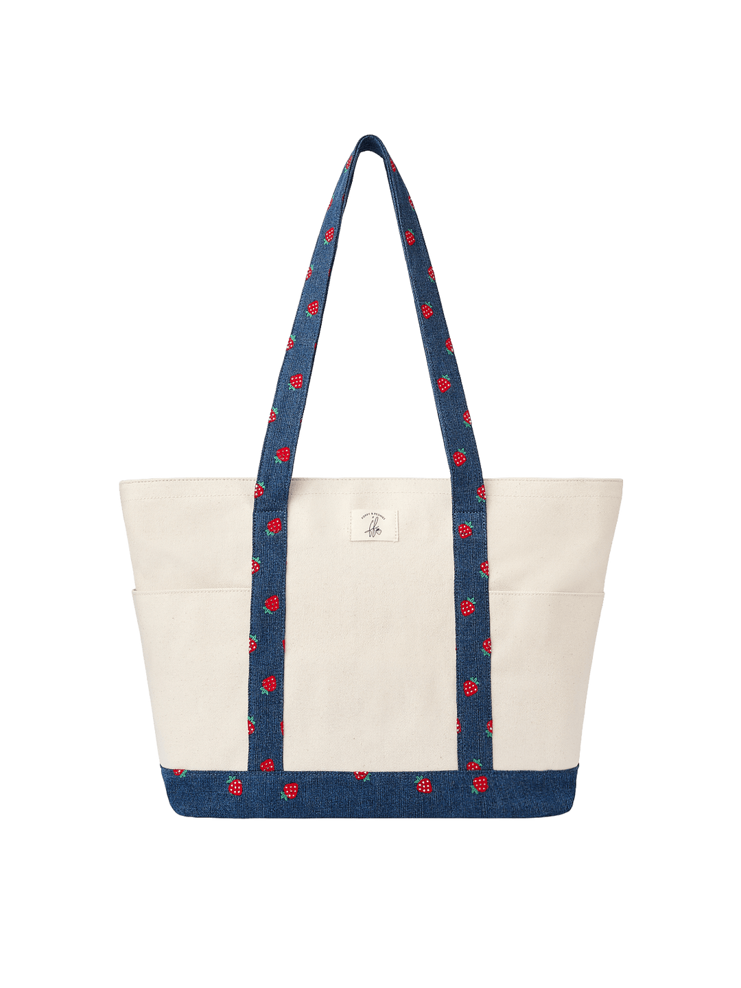 Poppy & Peonies Analog Tote in Strawberry Denim front view, featuring a cream canvas exterior with navy strawberry-print straps and matching base trim.
