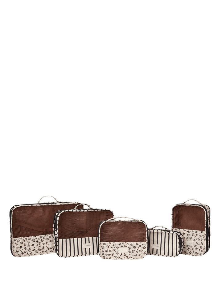 Set of five floral and stripe pattern packing cubes.