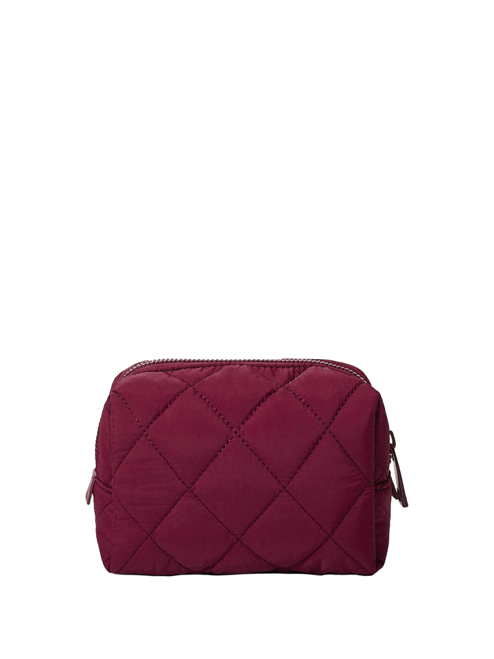 Quilted berry coloured cosmetic bag on a transparent background