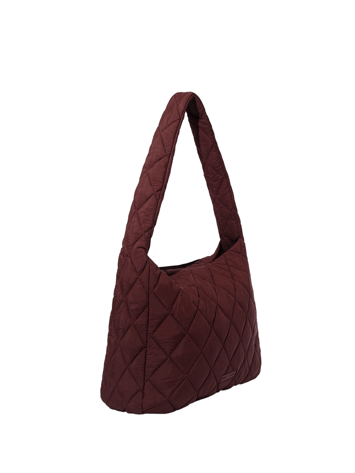 Quilted handbag with a clear background