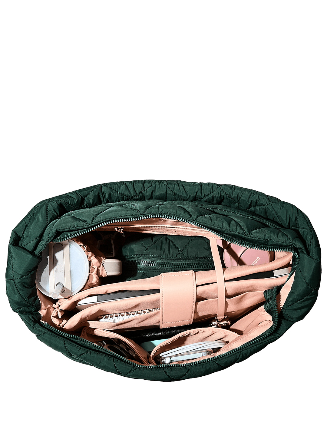 Green quilted bag with pink interior