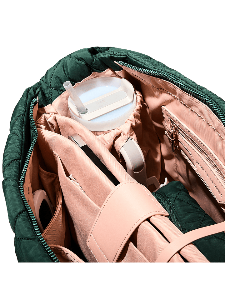 Quilted green bag with a water bottle holder