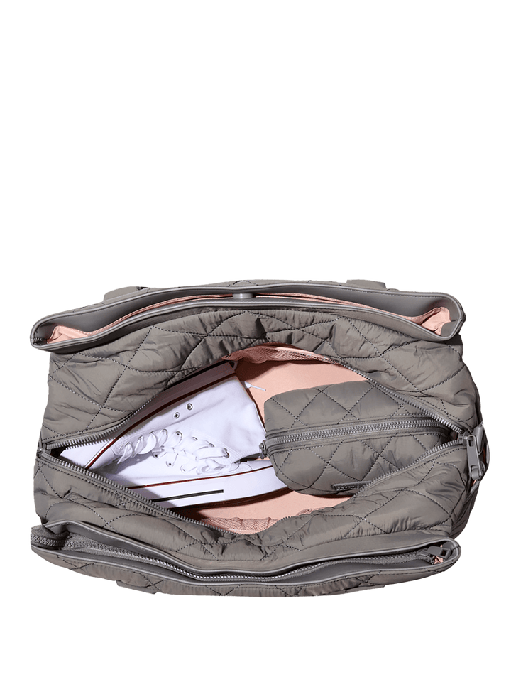 Open grey quilted travel bag 