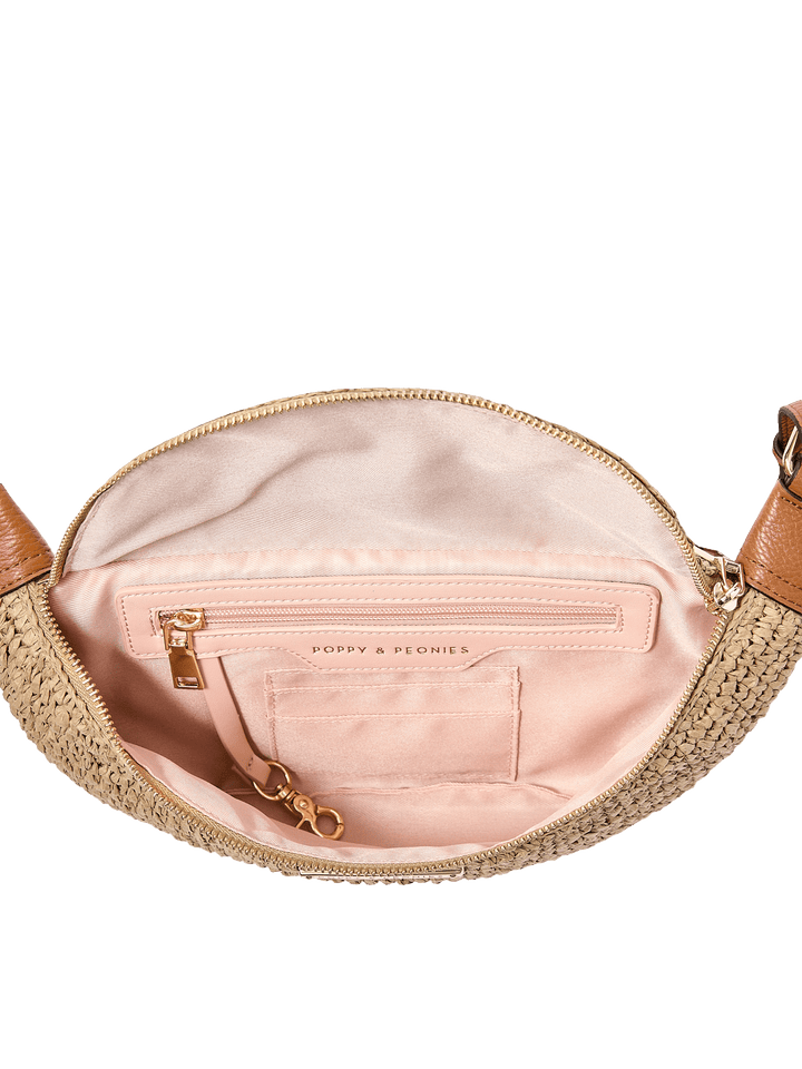 Open straw handbag with pink interior