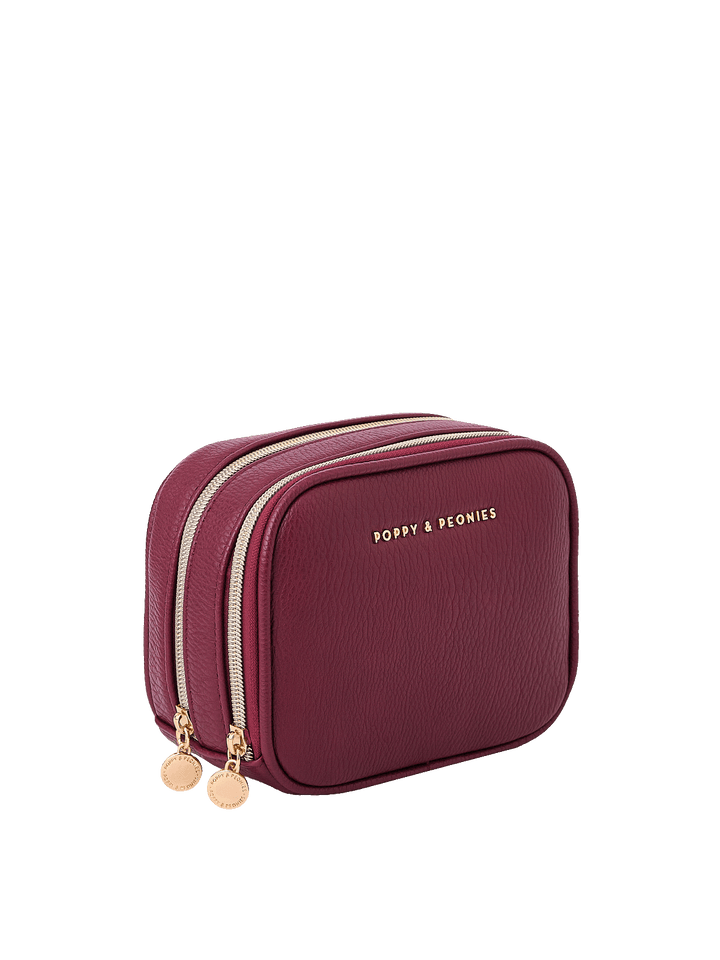 Angled side view of Pretty Connected Case in Berry showing dual zip compartments