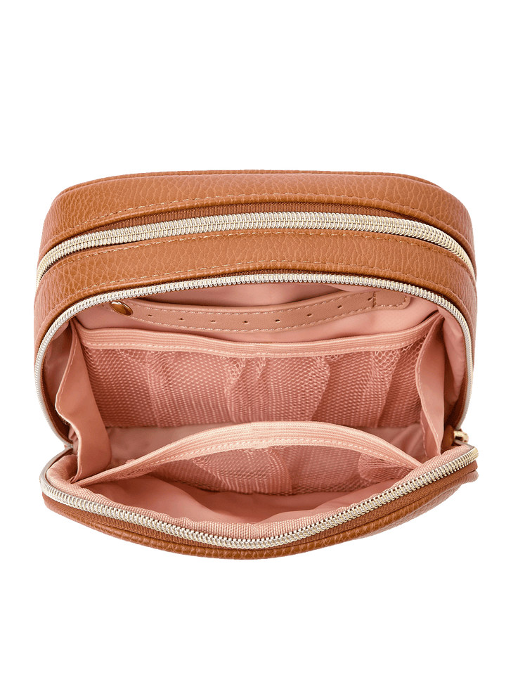 Pretty Connected Case in Cognac opened to show cosmetic compartment with jewelry tab and mesh pockets
