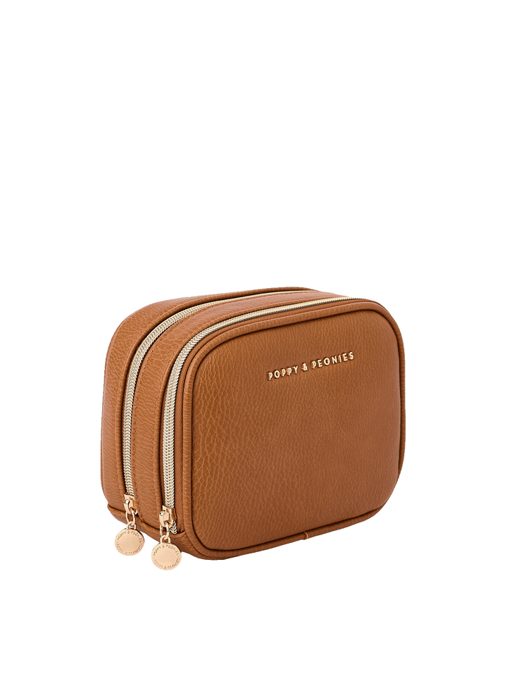 Angled side view of Pretty Connected Case in Cognac showing dual zip compartments