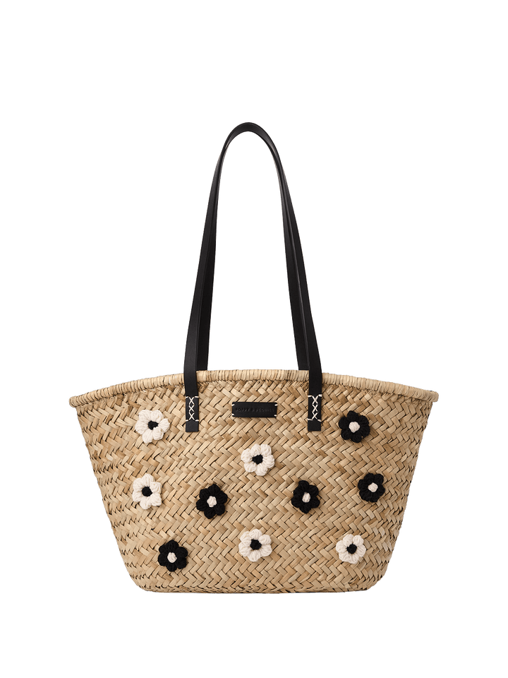 Woven handbag with floral embellishments