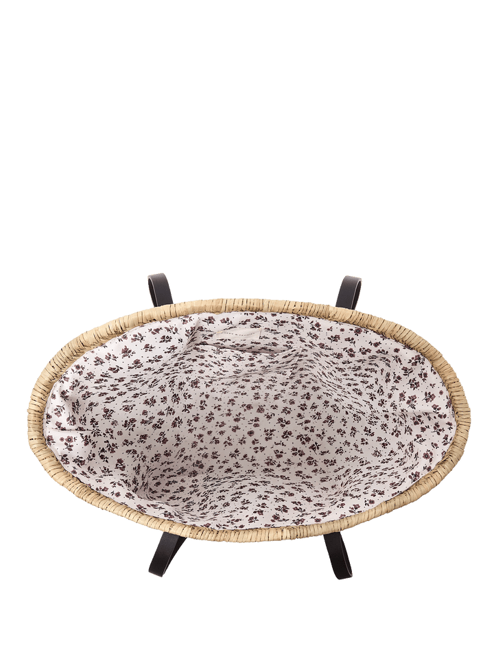 Open straw tote bag with floral print lining