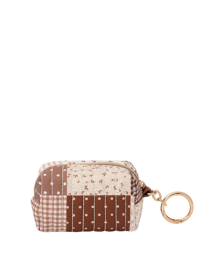 Side view of the Tag Along Charm in Brown Patchwork with gold-tone O-clasp