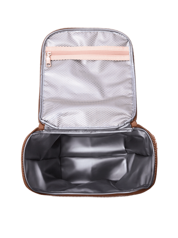 Interior of The Lunch Date lunch bag in Brown Patchwork showing insulated, wipeable lining and mesh storage pockets