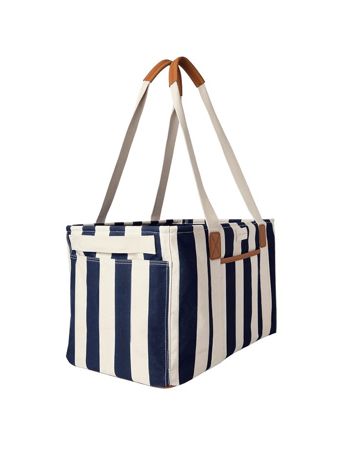Navy and white striped tote bag with brown leather accents