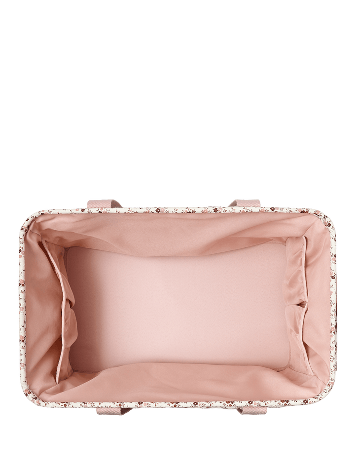 Interior of a floral-patterned tote bag with pink handles