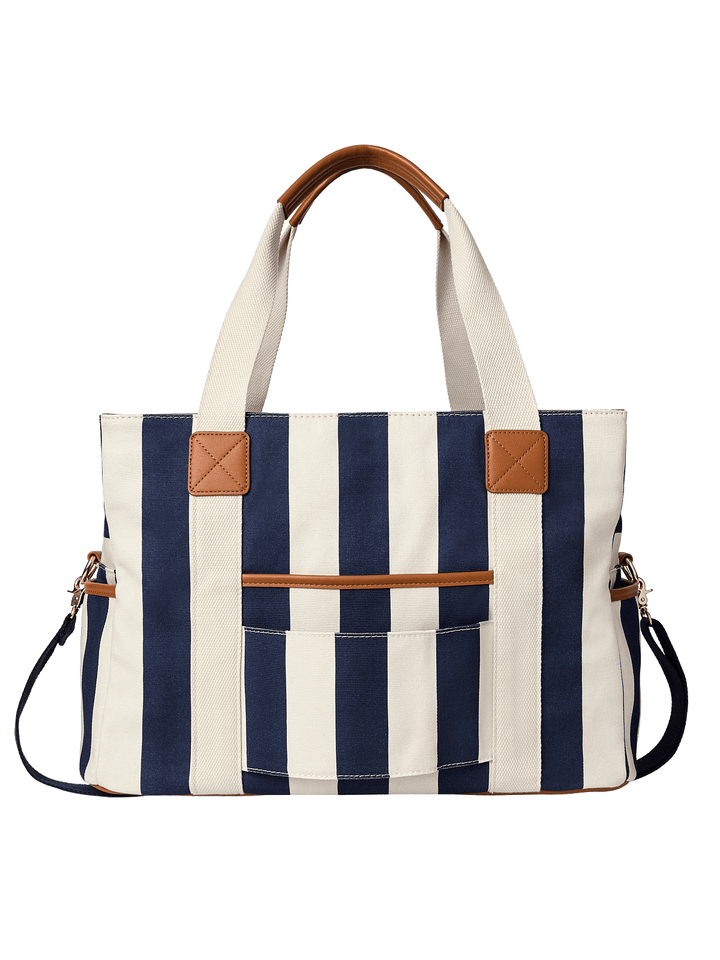 Navy and white striped tote bag with brown leather accents