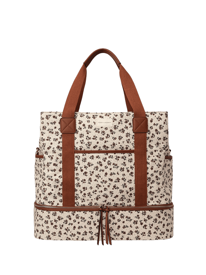 Floral-patterned travel bag with brown straps