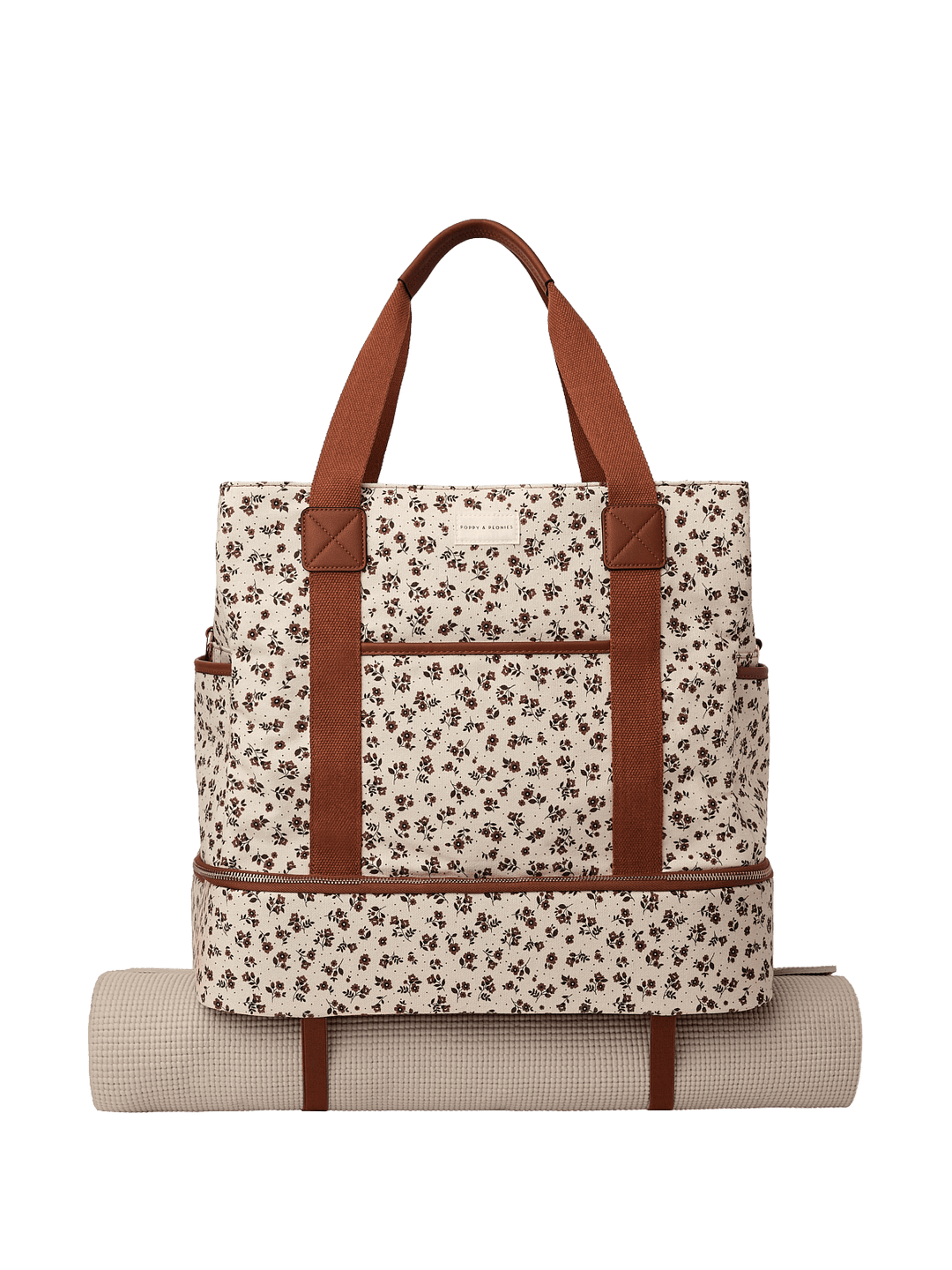 Floral-patterned travel bag with brown straps and a yoga mat attached to the bottom