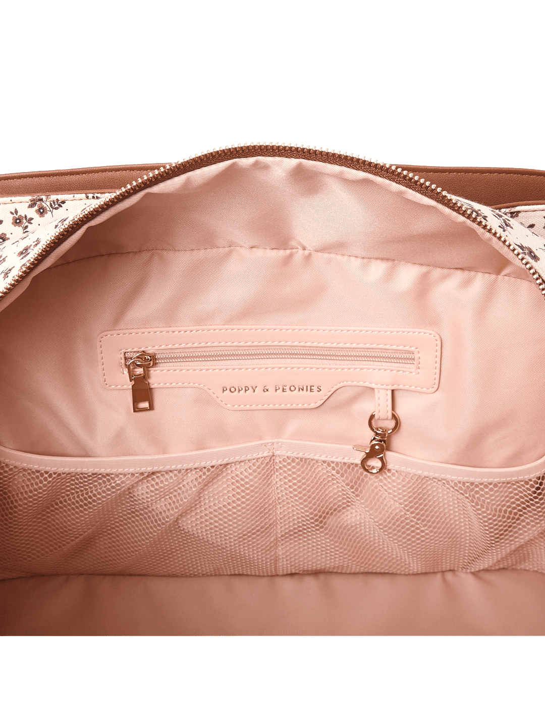 Close-up of the interior of a travel bag showcasing the pockets and key leash