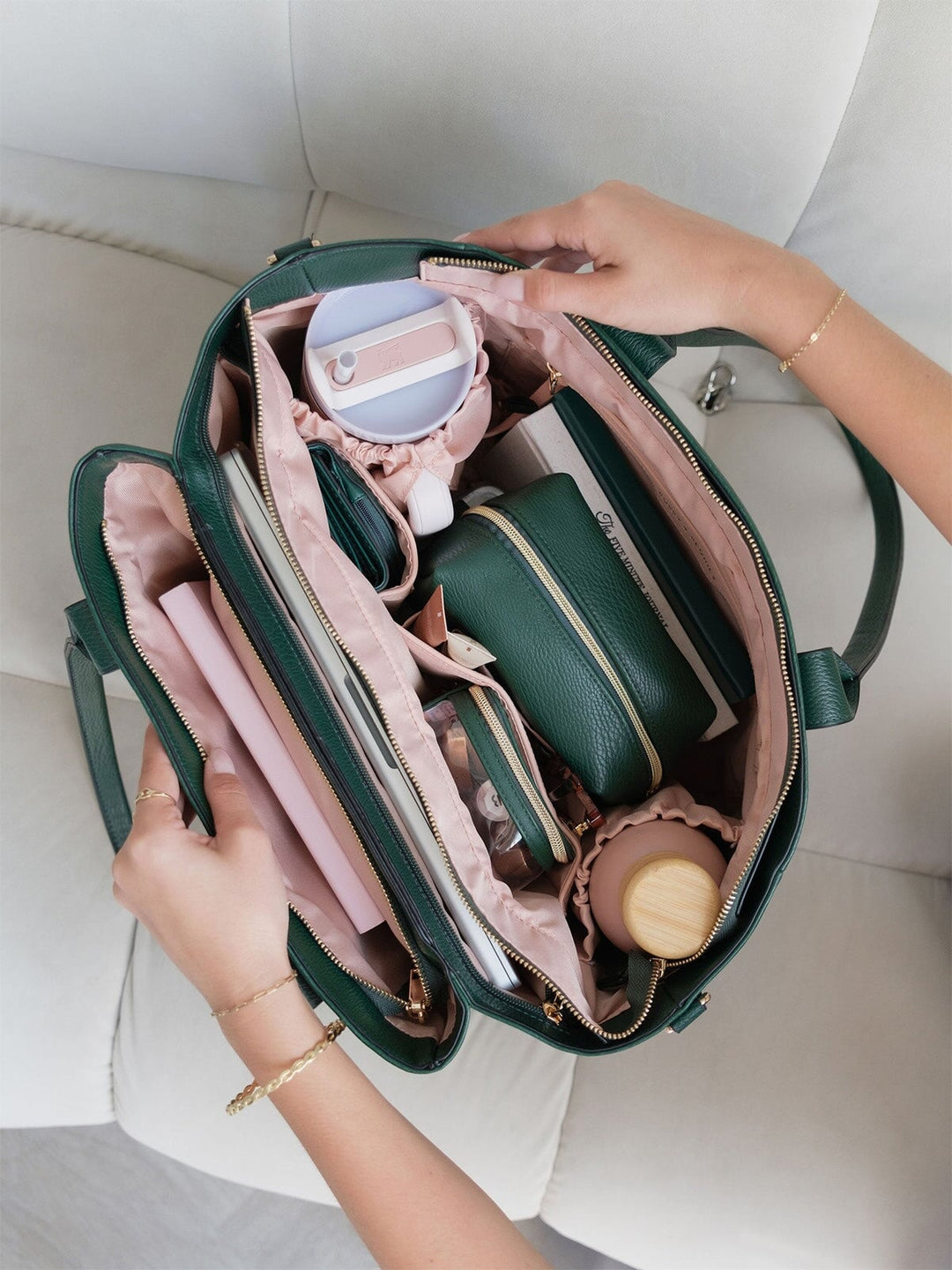 Overhead view of the Poppy & Peonies Double Duty Tote in Heritage Green packed with everyday essentials and organized interior compartments.